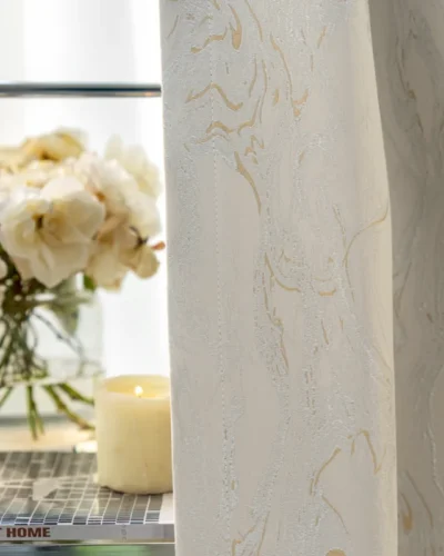 Ivory gold jacquard curtain with subtle stone vein texture and floral decor background