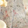 Fairy tale curtain close-up with castle and storybook botanical prints for kids