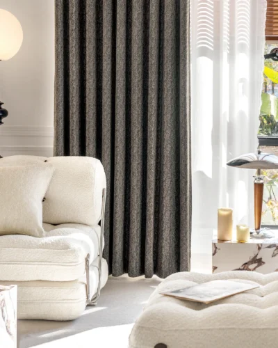 Ivory Breeze curtain softly draping in a sunlit modern living room with neutral decor