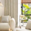 Ivory Breeze curtain softly draping in a sunlit modern living room with neutral decor