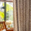 Floral Realm jacquard curtain in a bright window corner, styled with natural greenery and wood elements.