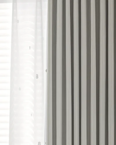 Blush Sweet Curtain in dark grey jacquard stripes, softly filtering light in a neutral kids’ or nursery room
