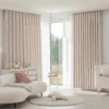 Soft mosaic jacquard curtain in pastel pink hanging in a cozy modern living room