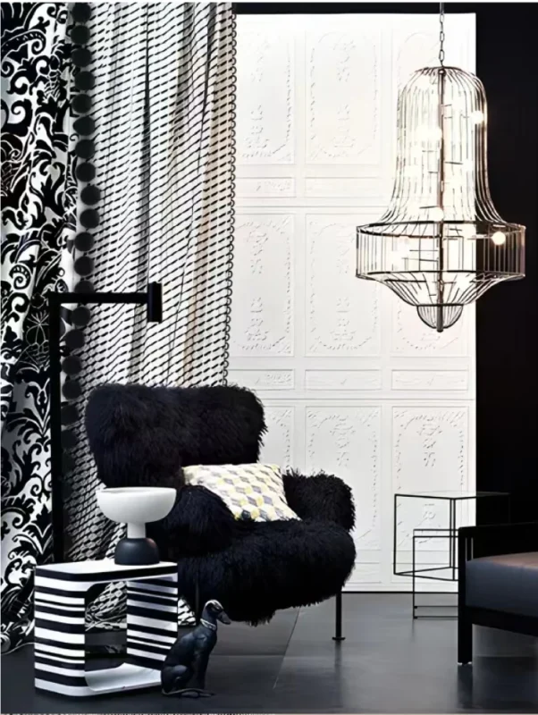 black velvet pom pom trim curtain in modern reading nook with armchair and chandelier