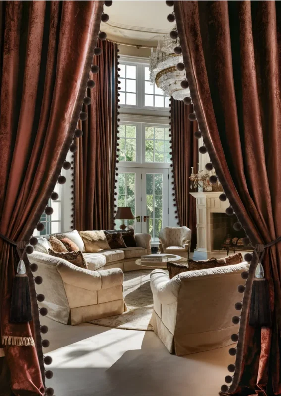 Luxurious brown curtains with black Mink Whisper Trim pom fringe in a modern living room