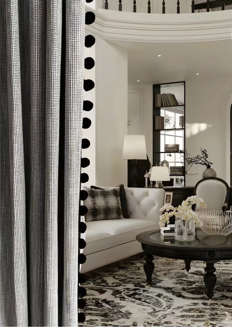 Soft pom pom trim on grey curtain in modern living room – decorative curtain detail