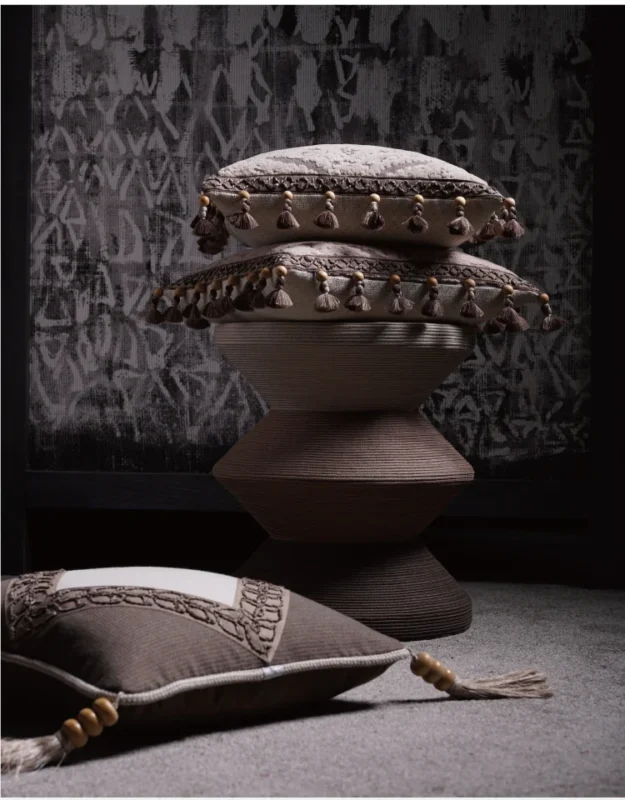 Stack of Cushions with Decorative Tassel Trims in Earth Tones