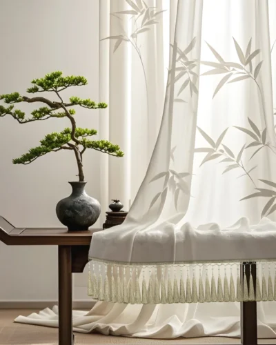 Bamboo tassel curtain fringe softly draping on sheer curtain in a Zen-inspired living space with bonsai