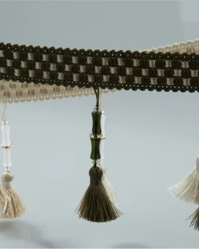 Bamboo-inspired curtain trim with olive green and ivory tassels