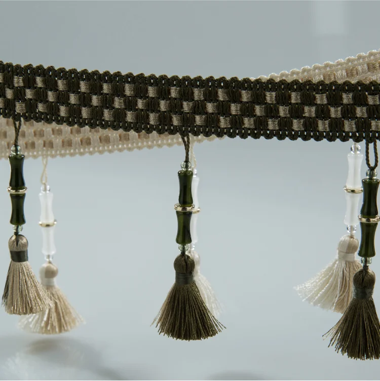 Bamboo-inspired curtain trim with olive green and ivory tassels