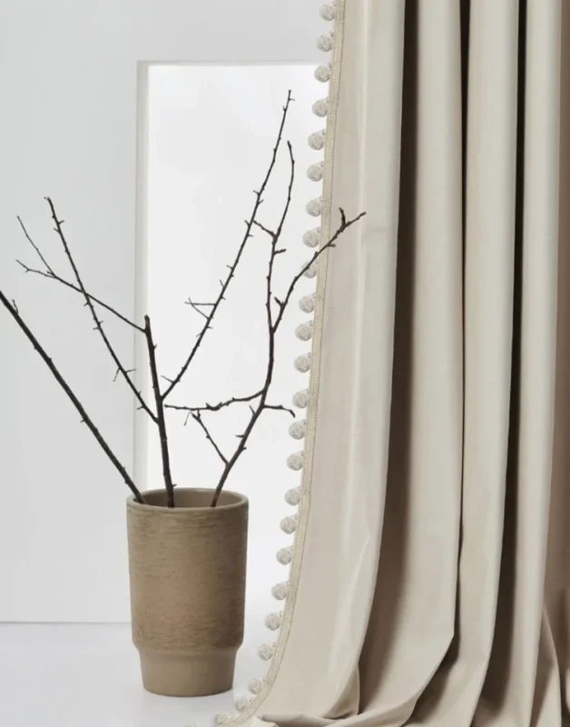 Beige curtain with Vine Cotton-Linen Pom Pom Trim hanging in a modern room