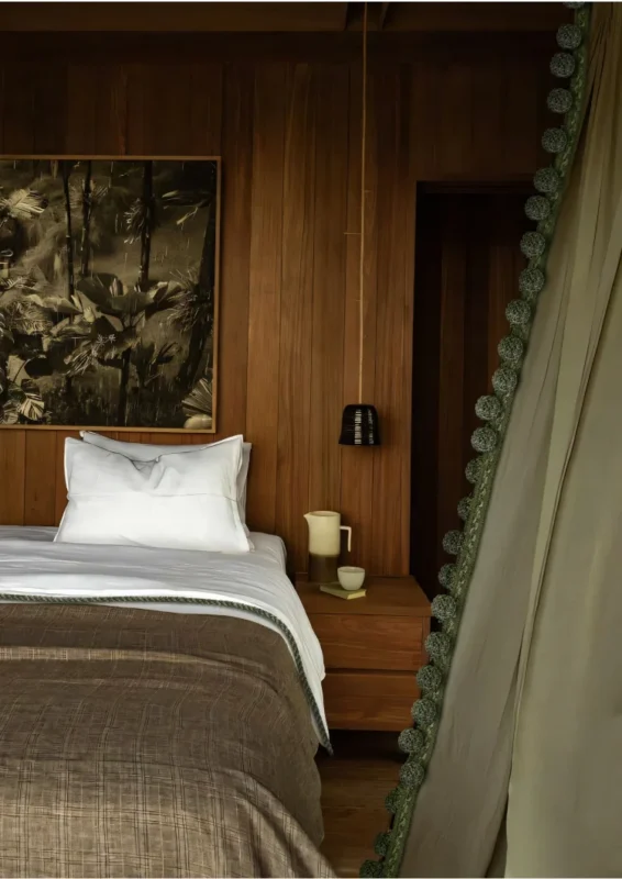 Woven Pom Pom Trim on green curtain in cozy bedroom interior