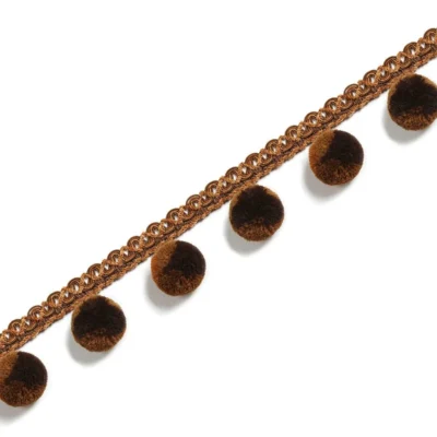 Chocolate pom pom curtain fringe with braided lace trim in warm brown tones