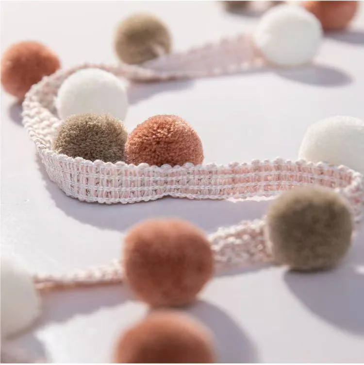 Color swatch of Eden Pom Tassel Trim – assorted pom pom colors in sample display