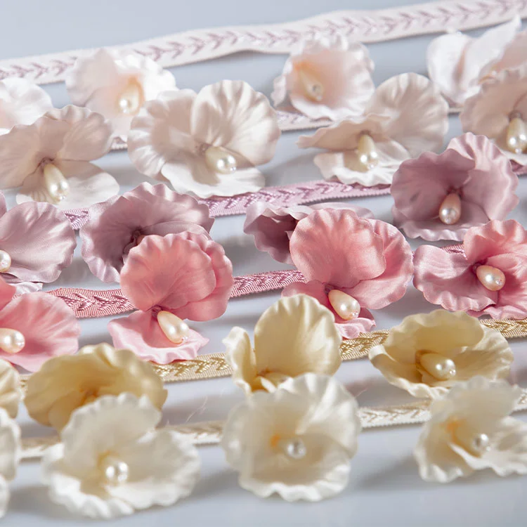Multicolor 3D floral lace trim with pearl centers in pink, cream, and yellow tones