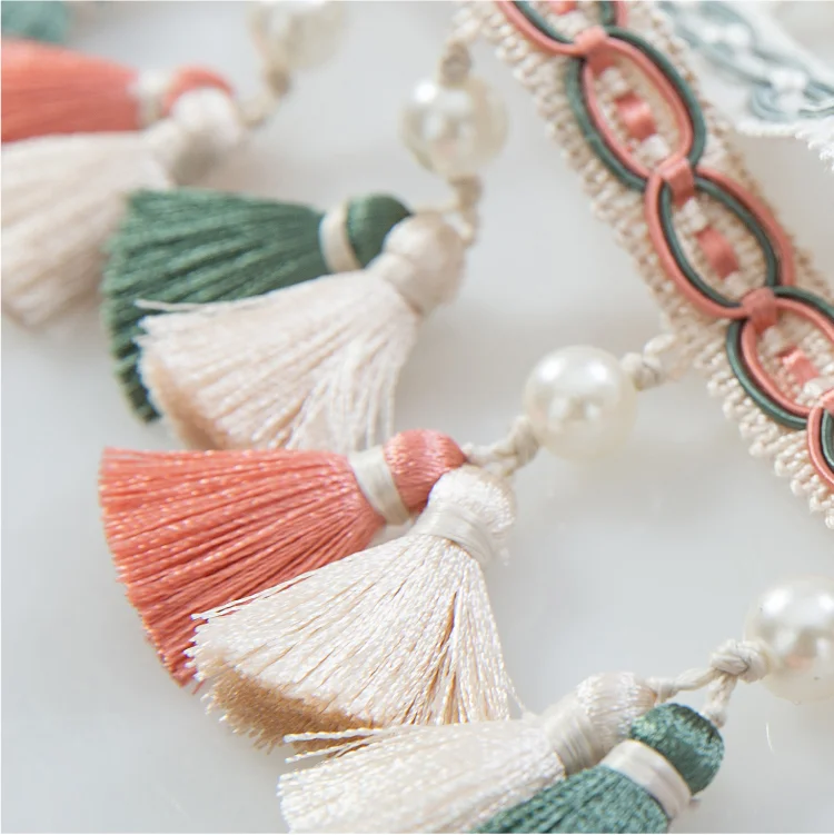 Annecy Tassel Curtain Trim in soft pastel tones with handcrafted detailing