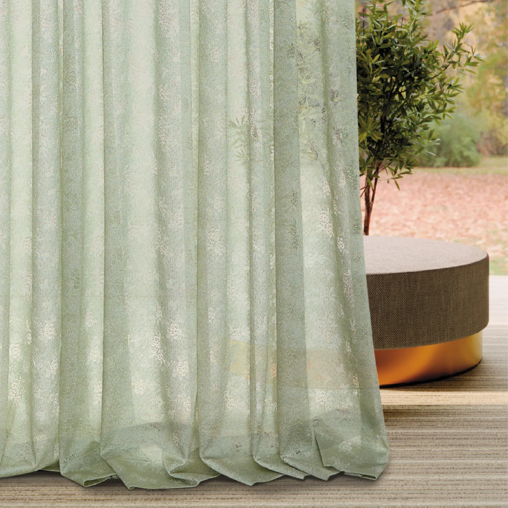 Bottom view of Olive Mist Curtain with soft folds and botanical sheer texture, gently filtering sunlight near a window with greenery outside