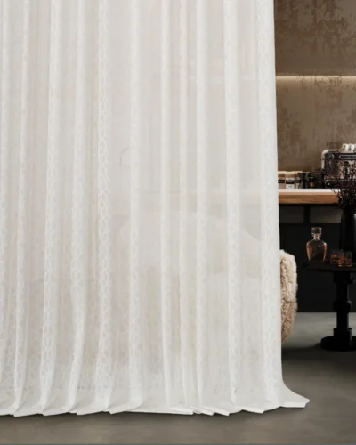 Lightflow lace curtain cascading down in a softly lit transitional room