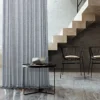 Zigzag sheer curtain in a modern loft interior with stairs and accent chairs