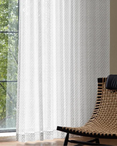 Jacquard Sheer Curtain with geometric leaf texture hanging beside a neutral wall and diffuser set