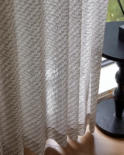 Light filtering jacquard curtain with geometric weave and soft shadows