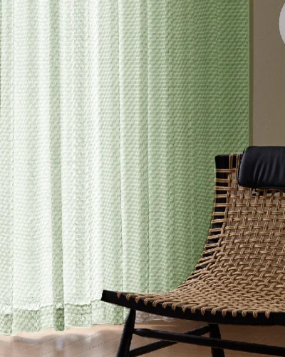 Jacquard Sheer Curtain with geometric leaf texture hanging beside a neutral wall and diffuser set