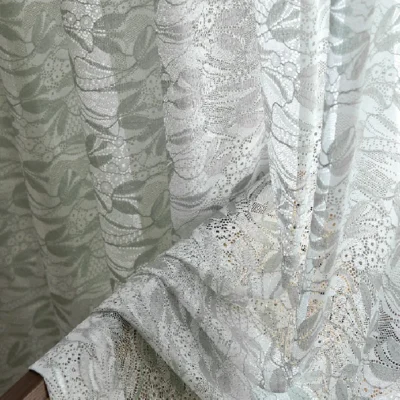 Close-up of Willow Whisper Curtain with double jacquard weave in soft green tones.