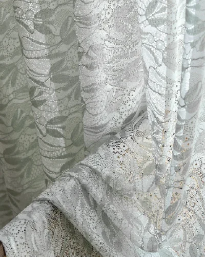 Close-up of Willow Whisper Curtain with double jacquard weave in soft green tones.