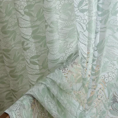 Close-up of Willow Whisper Curtain – dual-tone jacquard sheer with soft green leaf texture.