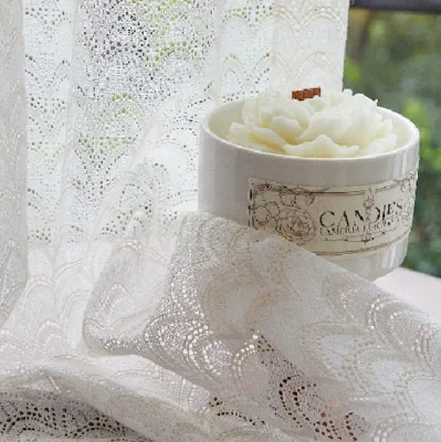 Sheer jacquard curtain with delicate scale-like patterns and soft drape