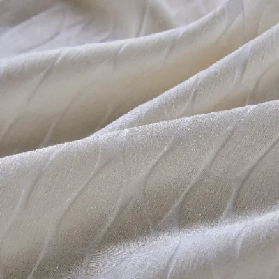 Close-up of Echo Leaf curtain fabric showing layered jacquard texture