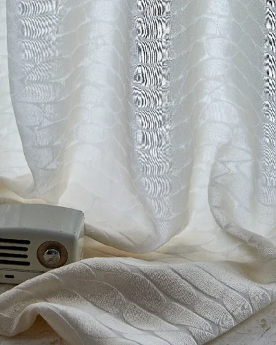 Echo Leaf curtain draped near a window with radio decor, showing soft light and jacquard texture