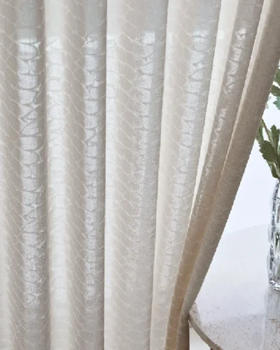 Close-up of Echo Leaf Curtain in textured jacquard voile softly flowing by the window