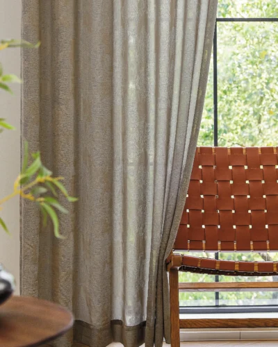 Dual veil jacquard curtain with soft grey tones and natural light filtering