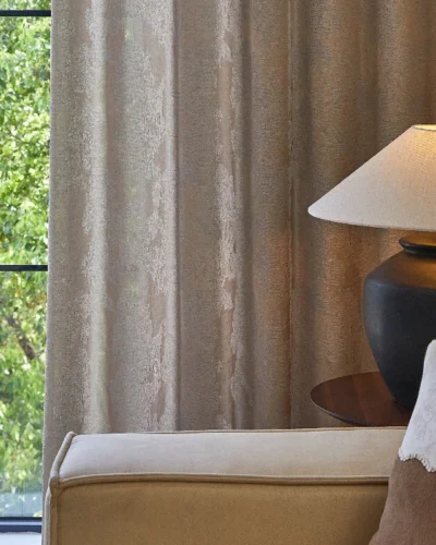 Dual veil jacquard curtain in beige filtering daylight in a modern bedroom