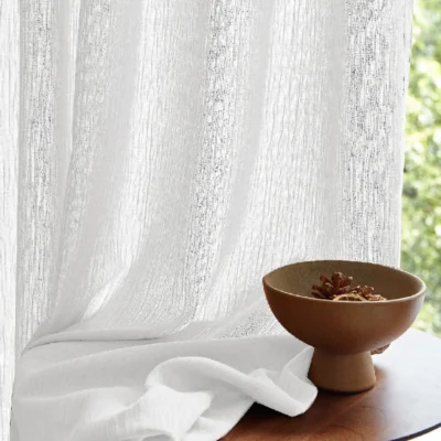 Textured chenille sheer curtain with soft drape and natural light filtering