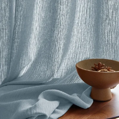 Blue chenille sheer curtain with soft texture and natural light filtering