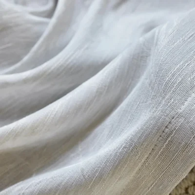 Close-up of Zen bamboo jacquard sheer fabric with soft drape and woven texture