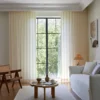 Botanical Jacquard Sheer Curtain hanging in a bright minimalist living room