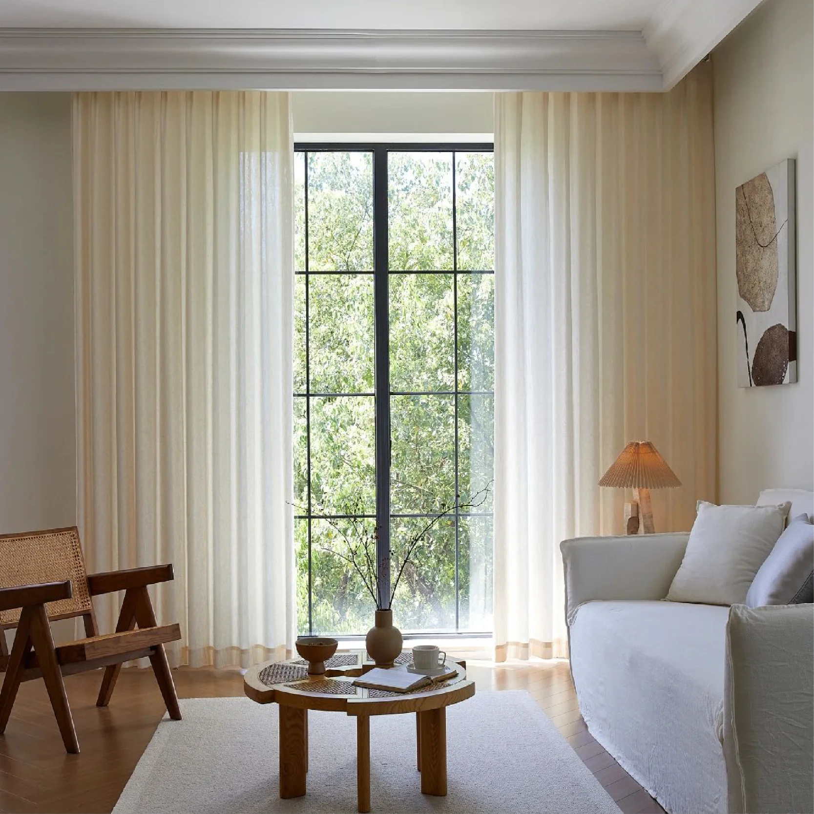 Botanical Jacquard Sheer Curtain hanging in a bright minimalist living room