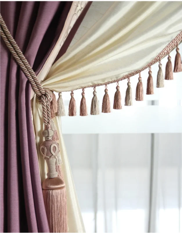 Two-tone curtain with tassel tieback – Elegant purple and cream drapery design