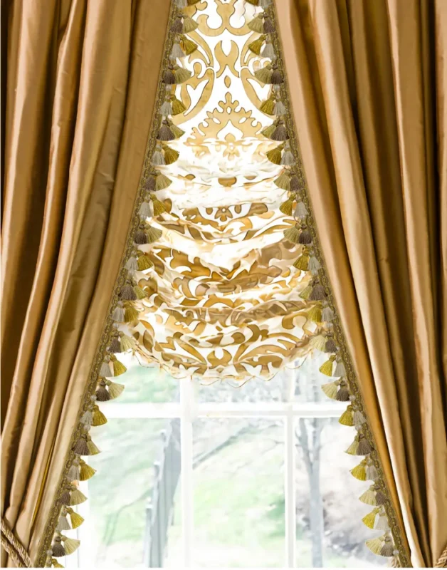 Elegant gold valance curtain with ornate tassel trim in classic European style