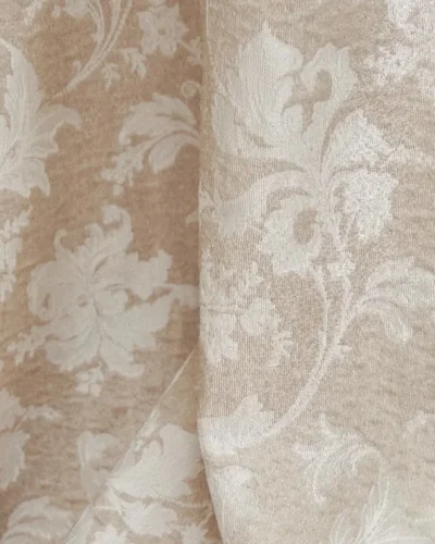 Warm beige floral jacquard sheer curtain pattern with vine motif, light filtering in sunlight