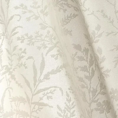 Ivory Botanica Jacquard Curtain softly filtering sunlight by a window with subtle floral vine texture