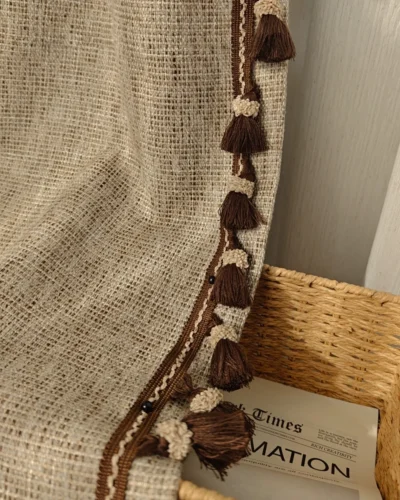 Cocoa fringe jacquard linen-cotton chenille curtain flat lay with tassel trim and textured weave