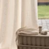Soft textured curtain fabric with lattice weave for custom drapes.