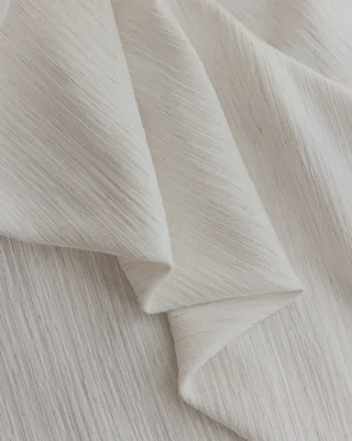 Ridge Texture Curtain – close-up of soft cream woven textured curtain fabric