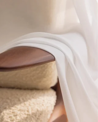 Cloudveil Sheer Curtain – close-up of soft white voile fabric draped over a wooden chair