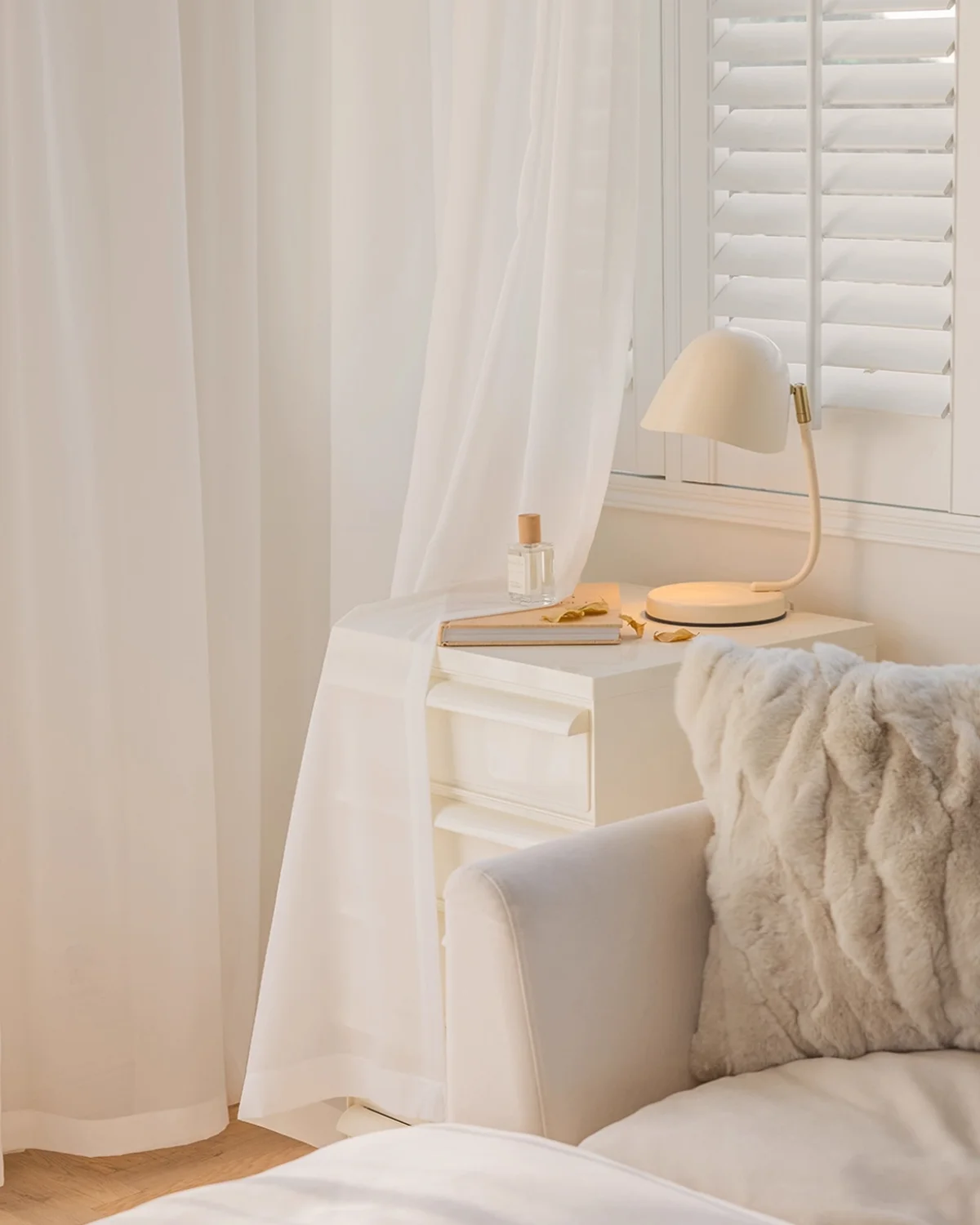 Cloudveil Sheer Curtain – white sheer curtain by the bedside with cushions and soft daylight