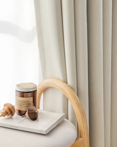 Beige blackout curtains in a bright room with natural light and modern decor